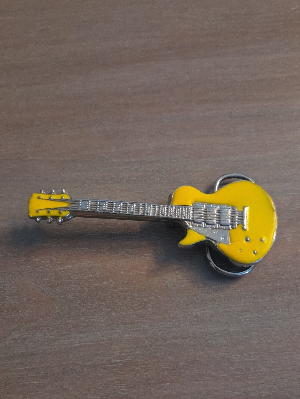 yellow electric guitar novelty belt buckle shaped in a single-cutaway style